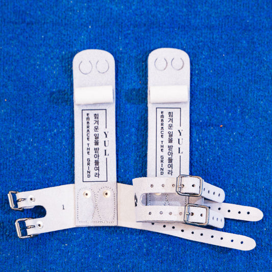 Yul Moldauer signature ring gymnastics grip by Wolf Wear, showing YUL branding and Embrace the Grind detail