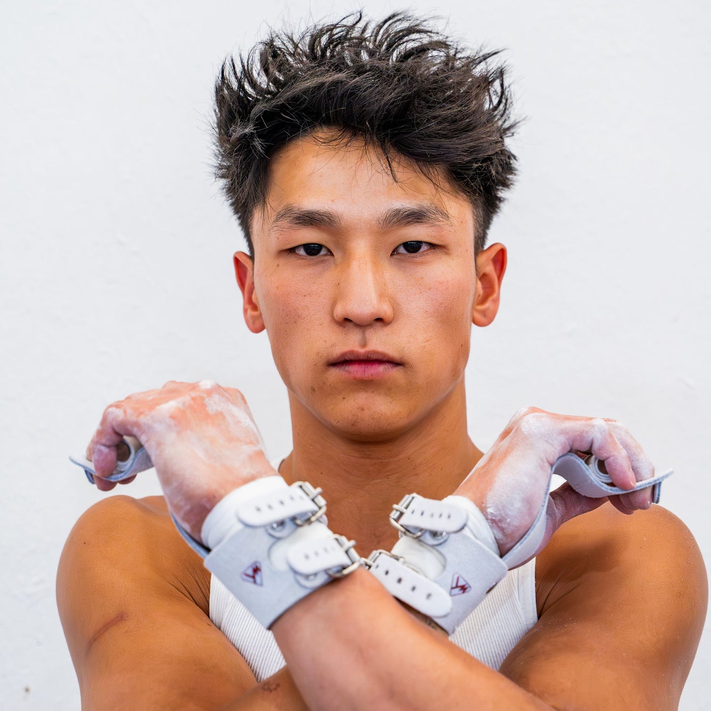Yul Moldauer wearing his Wolf Wear signature ring grips, arms crossed